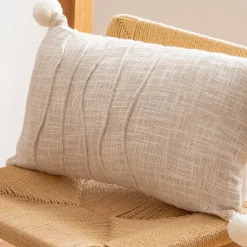 Coussin 30x50cm naturel pompons